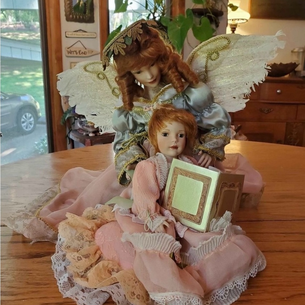 Paradise Galleries Angel looking over child. EUC